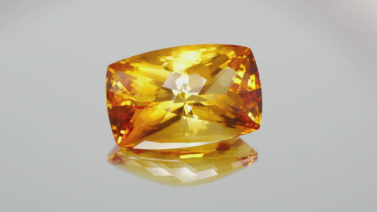 Natural citrine, 44.36 carats, cushion cut, VVS clarity, heated, orange / yellow