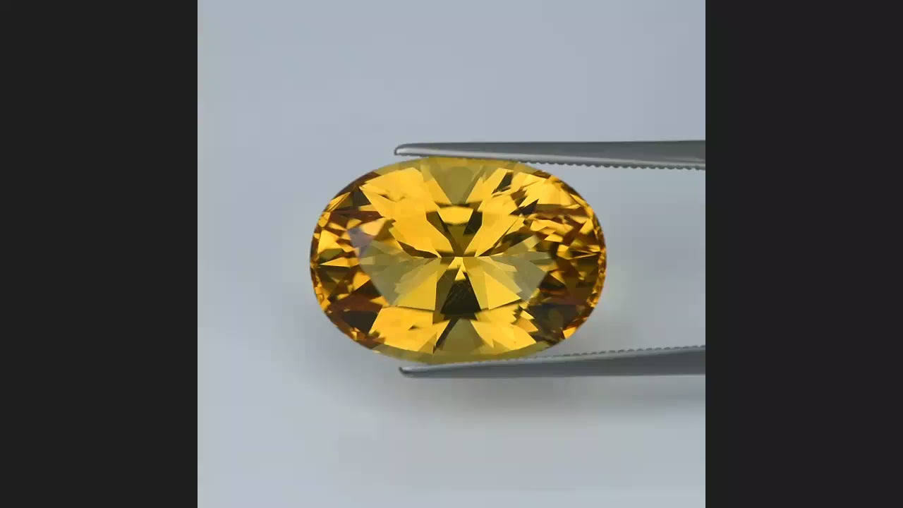 Natural citrine, 19.29 carats, oval cut, IF clarity, heated, yellow / orange