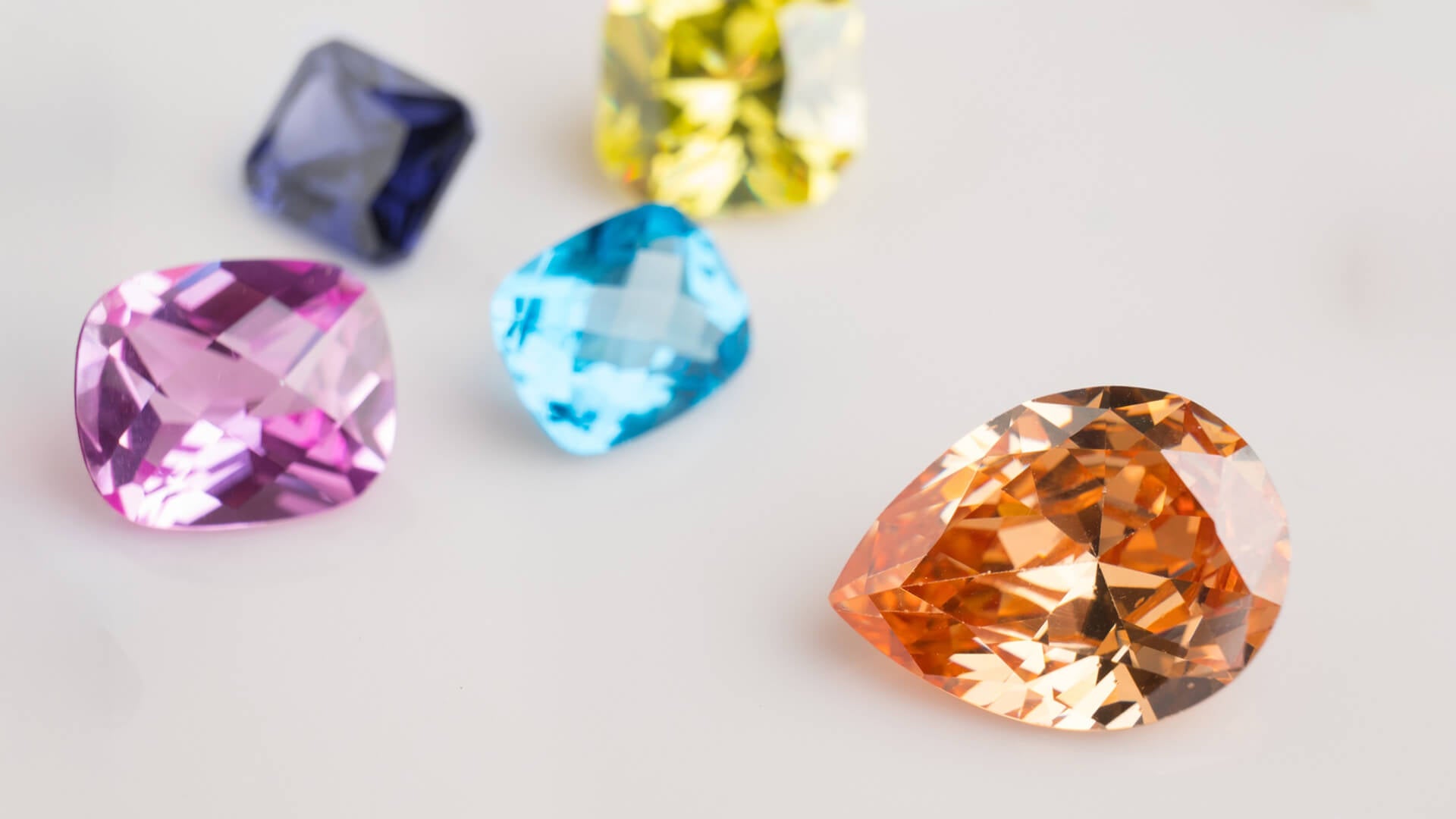Colorfull gemstones on white background 