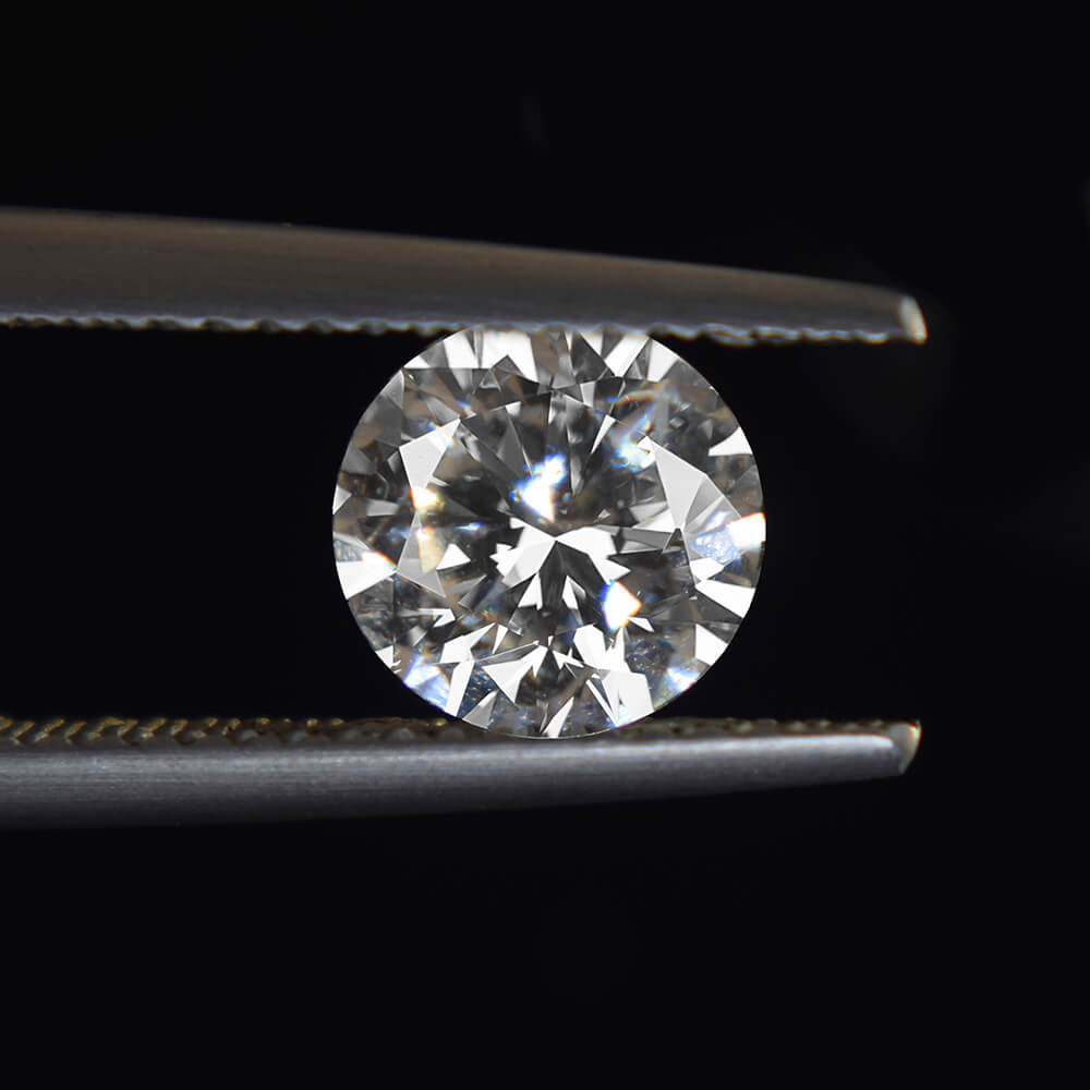 Natural diamond in tweezers