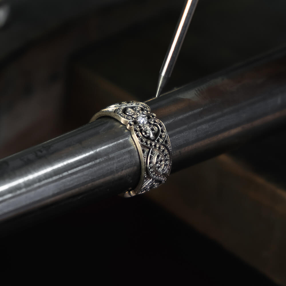 Setting diamond ring on custom jewelry