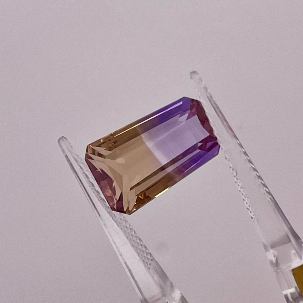 Natural Ametrine 7.03 carats, tapered baguette cut, flawless purple-yellow bi-color gemstone, untreated